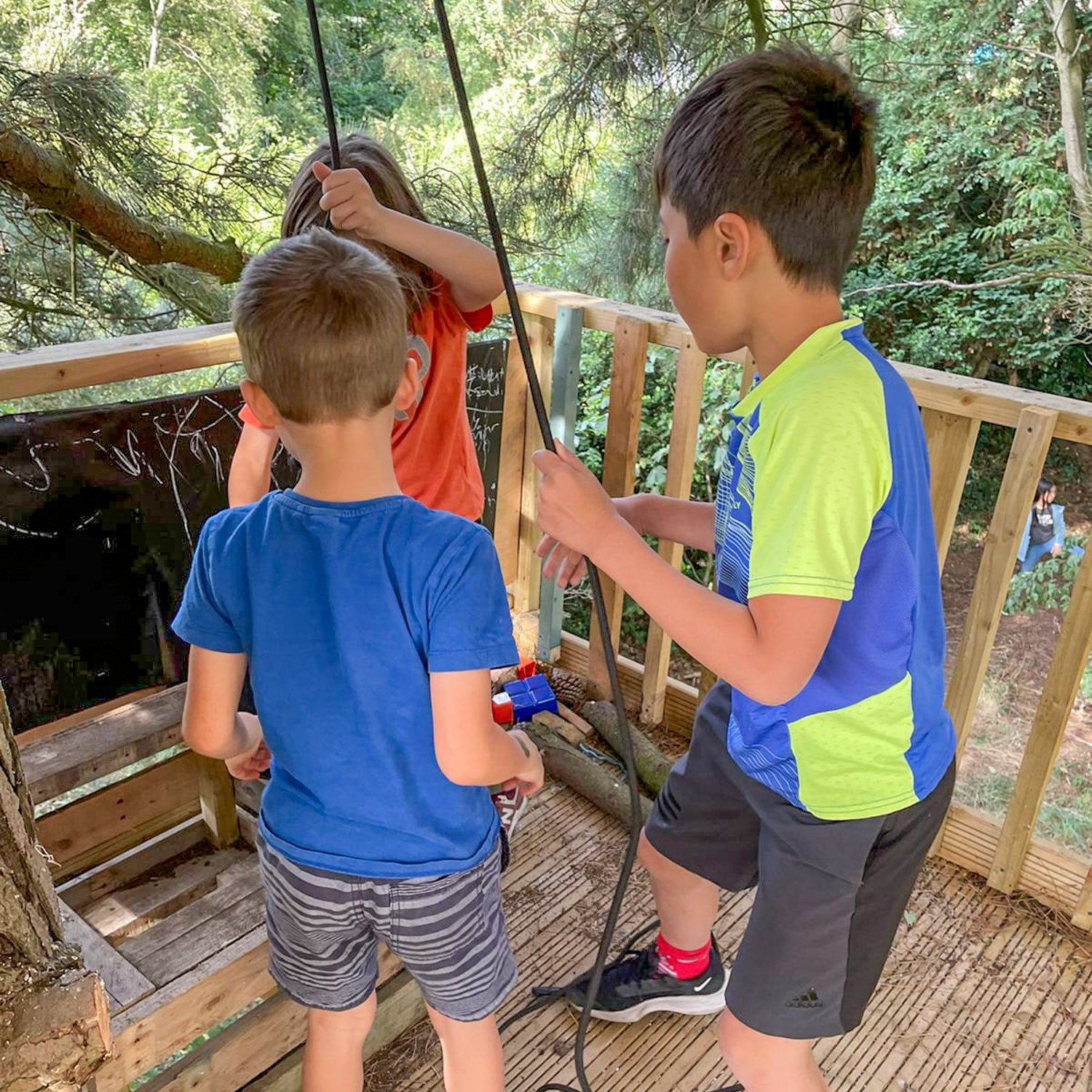 Kids playing on treehouse platform - good for permit